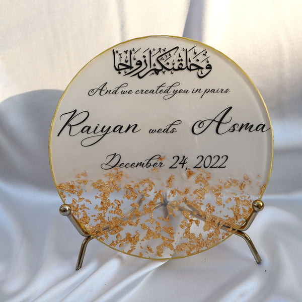 Buy / order Circle shaped resin nikah frames with gold foils online in India. And get delivered pan India near me. Order all resin and acrylic handmade art pieces from https://www.thewalloffaith.com/ the official website of wall of faith. Can be kept as table decor. Can be used for marriage gift, nikah gift, engagement gift, couple gift, anniversary gift.