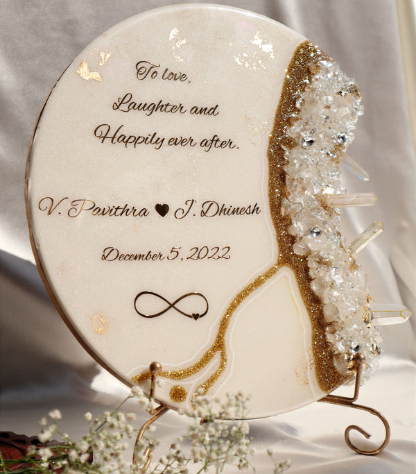 Buy / Order Crescent shaped resin marriage frame with crystals and pointer stones online in India. And get delivered pan India near me. Order all resin and acrylic handmade art pieces from https://www.thewalloffaith.com/ the official website of wall of faith. You can gift this unique frame to couple as a wedding gift, marriage gift, engagement gift, nikkah favour, room decor, table decor. best save the date frame.