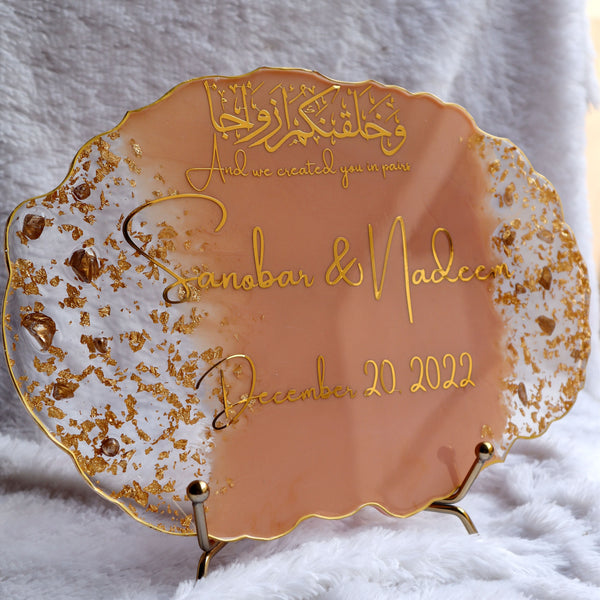 Buy / Order Irregular shaped Nikah resin frame with peach shade online in India. And get delivered pan India near me. Order all resin and acrylic handmade art pieces from https://www.thewalloffaith.com/ the official website of wall of faith. You can gift this unique frame to couple as a wedding gift, marriage gift, engagement gift, nikkah favour, room decor, table decor. best save the date frame.